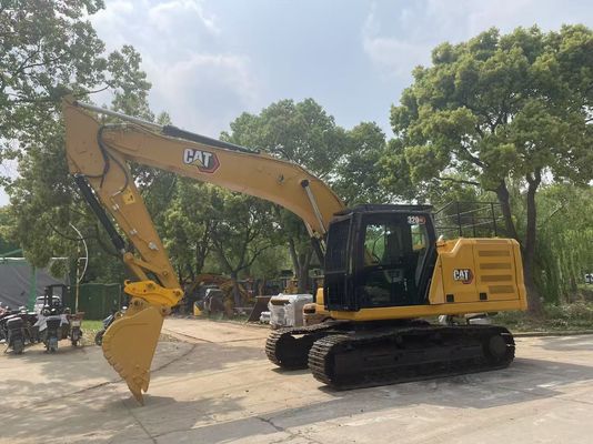 Excavadora Caterpillar 320GC em bom estado, usada, com engate hidráulico