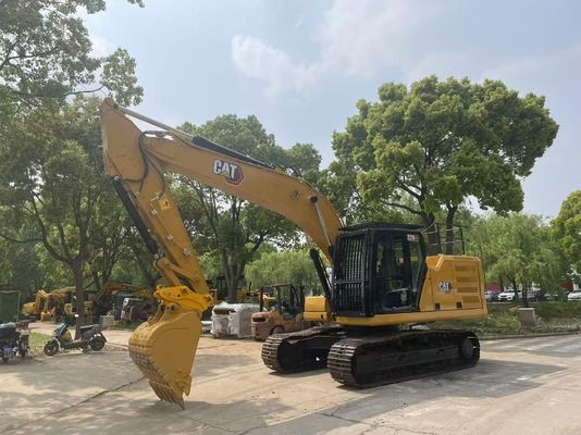Excavadora Caterpillar 320GC em bom estado, usada, com engate hidráulico