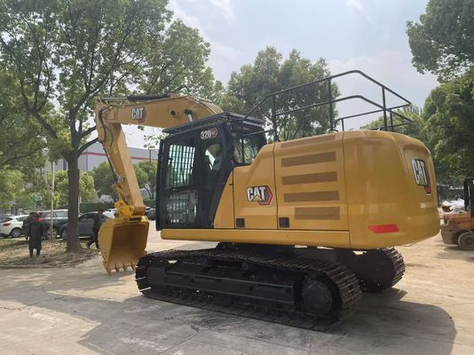 Excavadora Caterpillar 320GC em bom estado, usada, com engate hidráulico